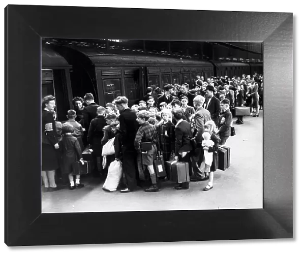 Children board a train at Euston Station during evacuation from London WW2