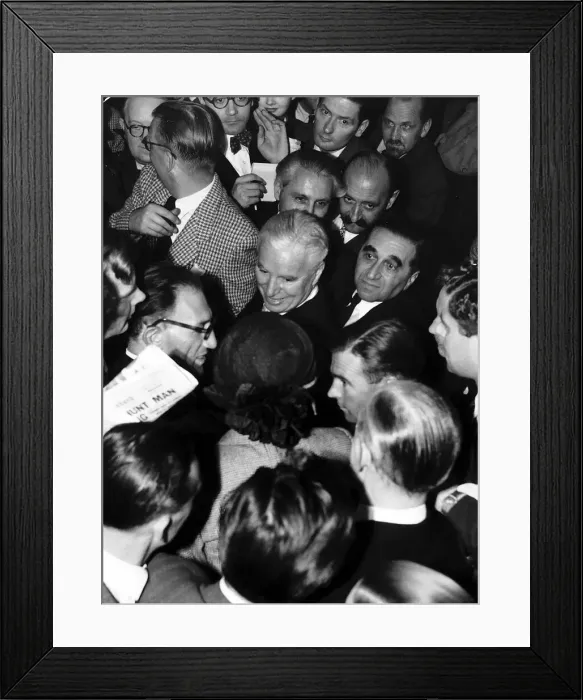 Framed Print : Charlie Chaplin Actor surrounded by people in a crowd