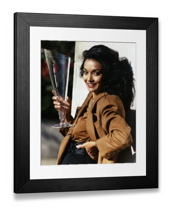 Framed Print : Shakira Caine wife of actor Michael Caine holding a long glass Framed Print : Shakira Caine wife of actor Michael Caine holding a long glass