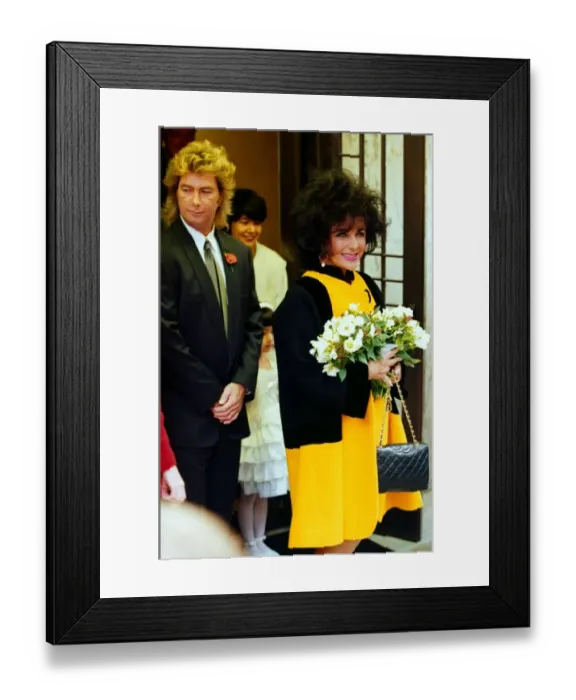 Framed Print : Elizabeth Taylor and her 8th husband construction worker Larry Fortensky arrive back Framed Print : Elizabeth Taylor and her 8th husband construction worker Larry Fortensky arrive back