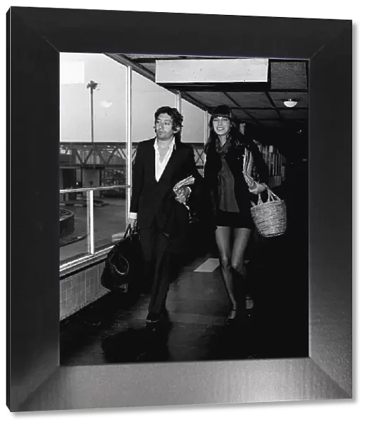 Jane Birkin and Serge Gainsbourg leaving for Paris where they are to recording a new