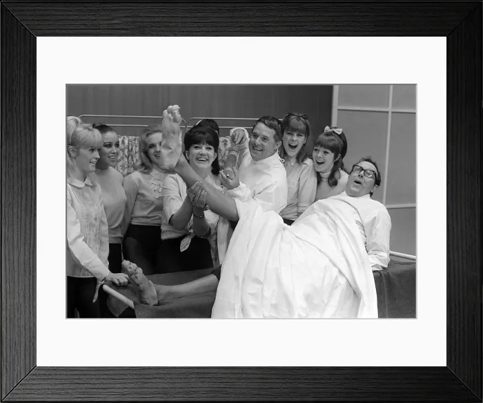 Framed Print : Eric Morecambe and Ernie Wise June 1965 clown it up with chorus girls in