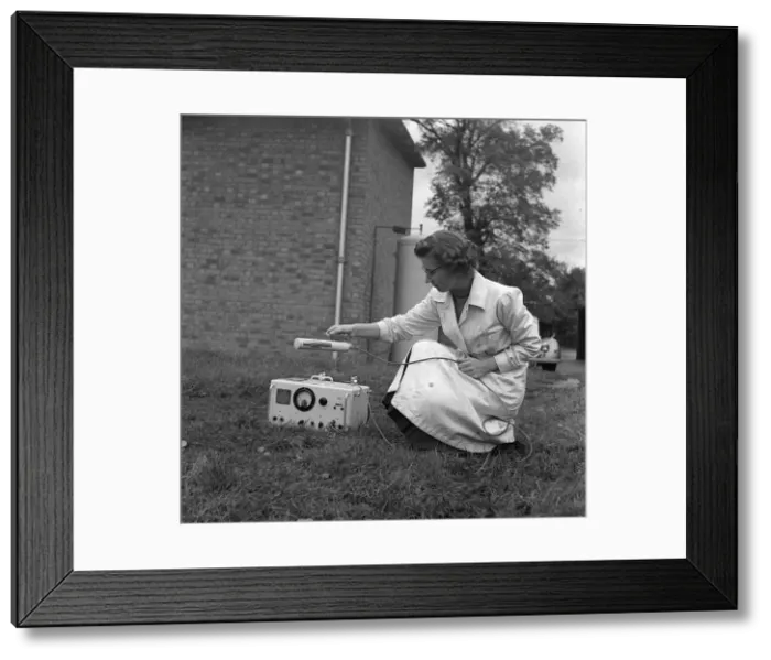 Framed Print : Geiger counter 1958 laboratory assistant using geiger counter A lab assistant Framed Print : Geiger counter 1958 laboratory assistant using geiger counter A lab assistant