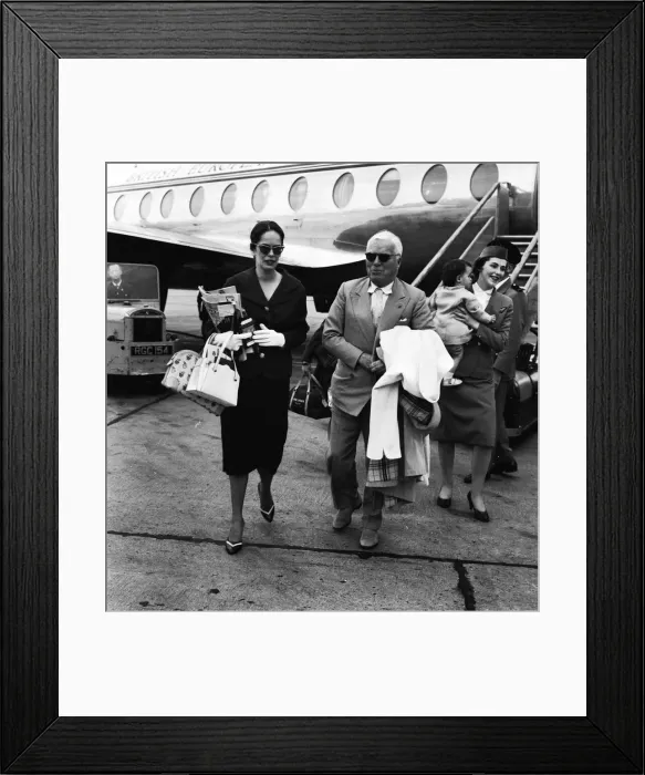 Framed Print : Charlie Chaplin with his wife1958