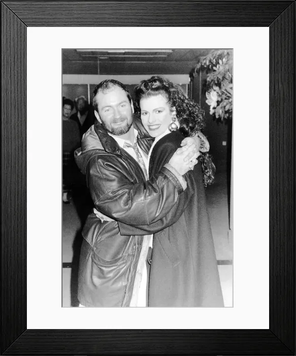 Framed Print : Kenny Everett Leaving Heathrow Airport With Friend Dbase Framed Print : Kenny Everett Leaving Heathrow Airport With Friend Dbase