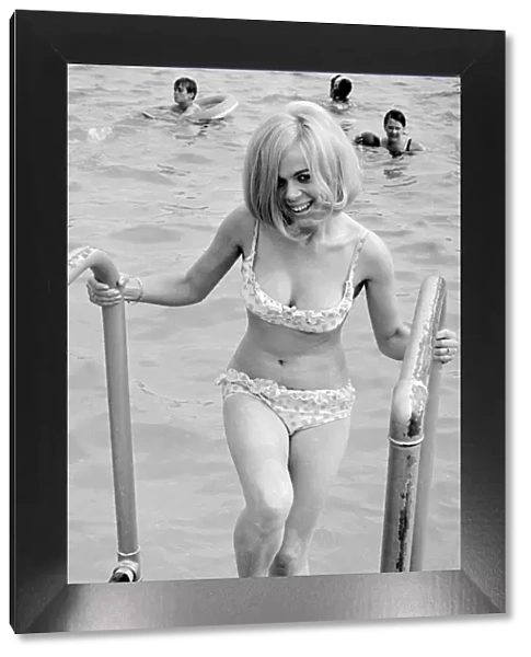 Girl in bikini enjoying the hot summer weather at Ryton open-air swimming pool, Coventry