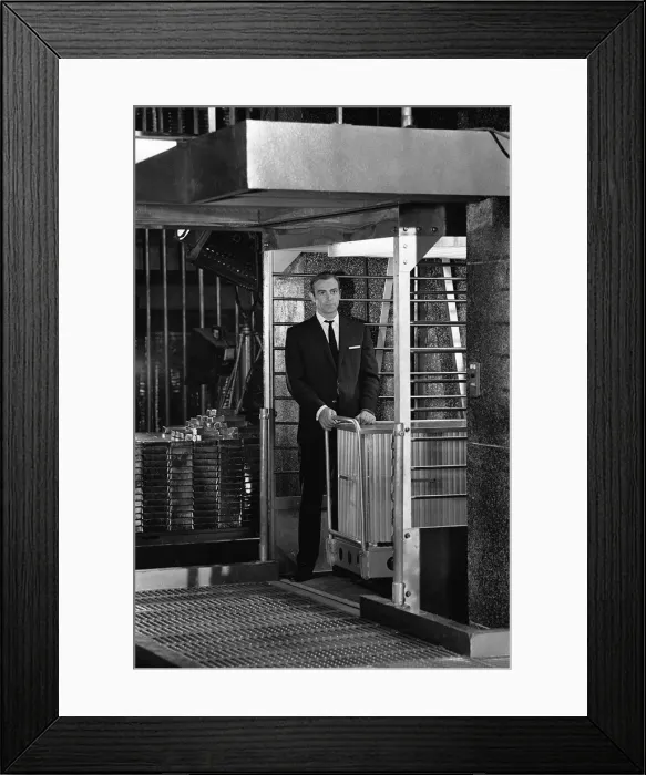 Framed Print : Film Goldfinger 1964 Sean Connery as James Bond 007 hand cuffed to a nuclear bomb in