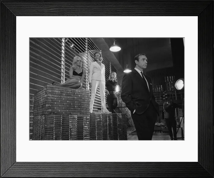 Framed Print : Film Goldfinger 1964 Sean Connery as James Bond 007 poses with Bond girls Honor Blackman