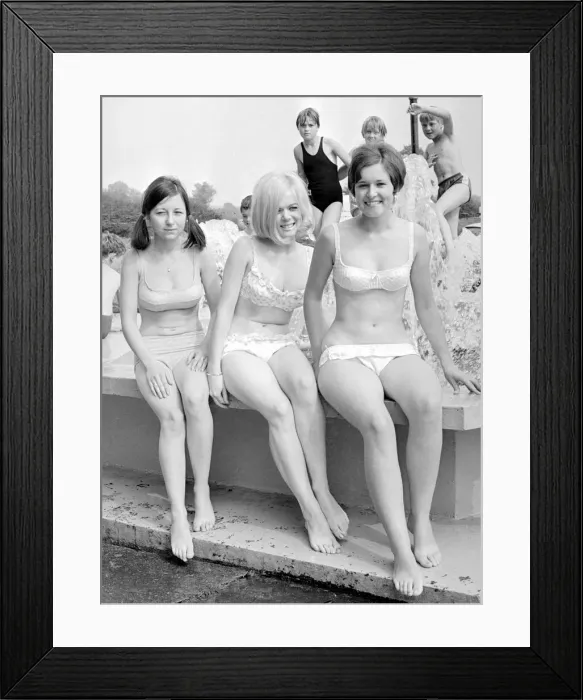 Framed Print : Girls in bikinis enjoying the hot summer at Ryton open-air swimming pool, Coventry Framed Print : Girls in bikinis enjoying the hot summer at Ryton open-air swimming pool, Coventry
