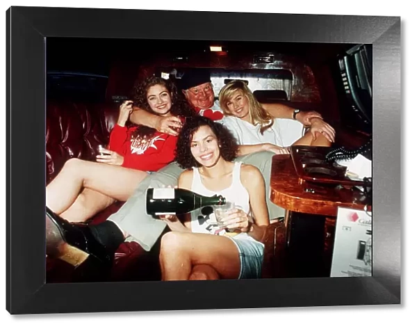 Comedian Benny Hill in a car with some of his Hills Angels