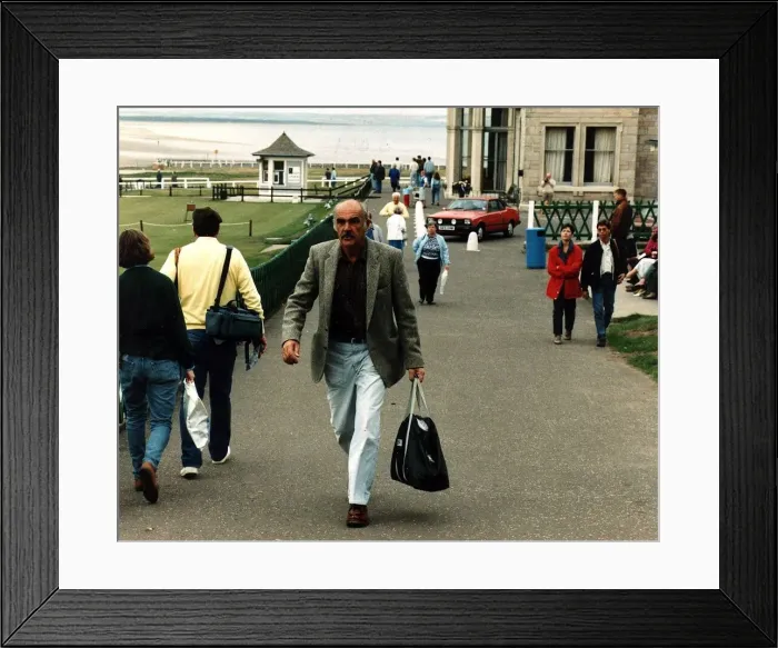 Framed Print : Sean Connery walking up street