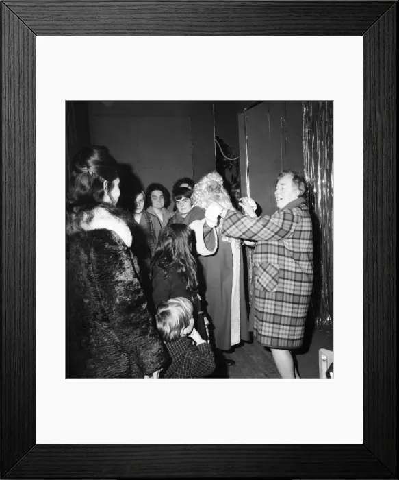 Framed Print : Christmas Humour - Santa. Father Christmas enjoys a dance at Lewis Framed Print : Christmas Humour - Santa. Father Christmas enjoys a dance at Lewis