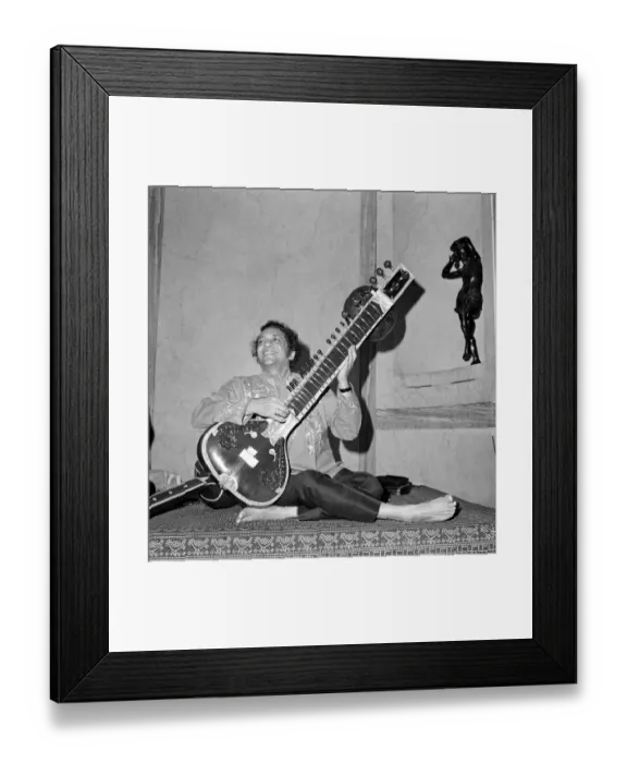 Framed Print : Ravi Shankar bare footed, plays his sitar at the Hyde Park Hotel Framed Print : Ravi Shankar bare footed, plays his sitar at the Hyde Park Hotel