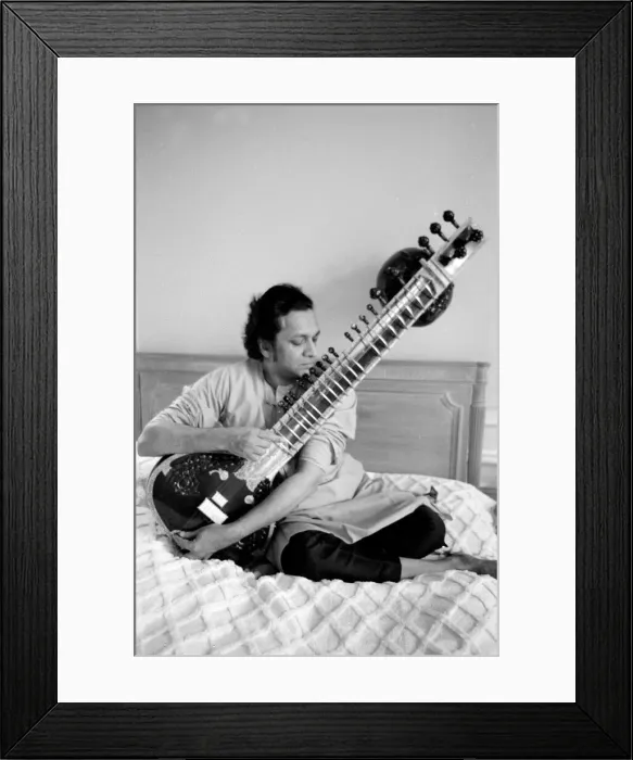 Framed Print : Ravi Shankar playing the sitar in his suite at the Savoy Hotel Framed Print : Ravi Shankar playing the sitar in his suite at the Savoy Hotel