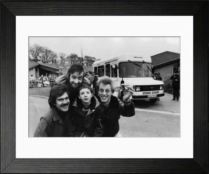 Framed Print : Three members of pop group Lindisfarne visit Trouts Lane Special School, in Durham City