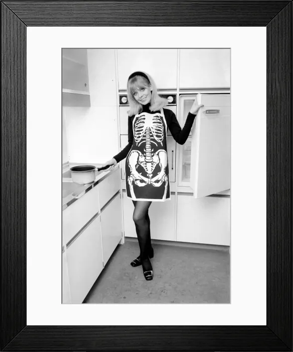 Framed Print : Model posing wearing a skeleton pinafore. December 1969 Z11686-006 Framed Print : Model posing wearing a skeleton pinafore. December 1969 Z11686-006