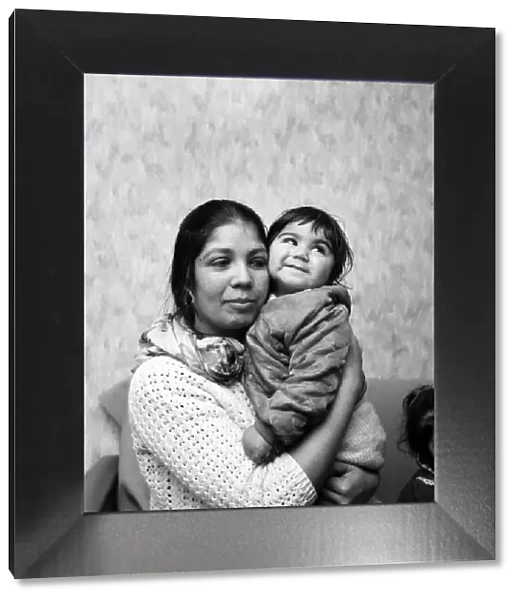 An Asian woman holding her little girl. December 1969 Z11628