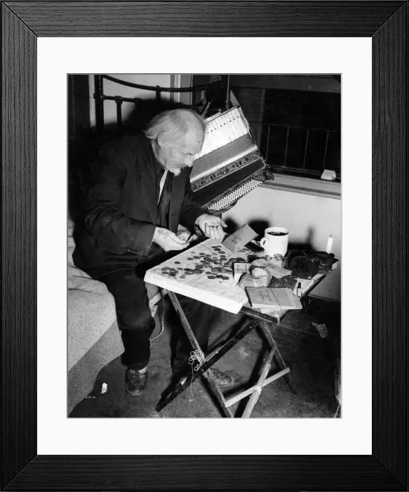 Framed Print : Buskers: Each night in his lonely bedroom, Gus Andrews counts the receipts for the day Framed Print : Buskers: Each night in his lonely bedroom, Gus Andrews counts the receipts for the day