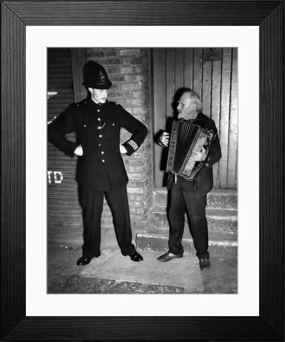 Framed Print : Buskers: The policeman recognizes Gus Andrews, and pauses during his beat to listen to a Framed Print : Buskers: The policeman recognizes Gus Andrews, and pauses during his beat to listen to a