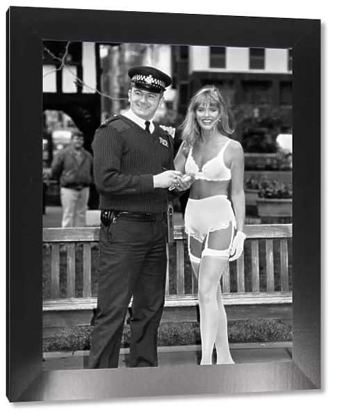 Lingerie that changes colour with your mood. Model in lingerie with policeman