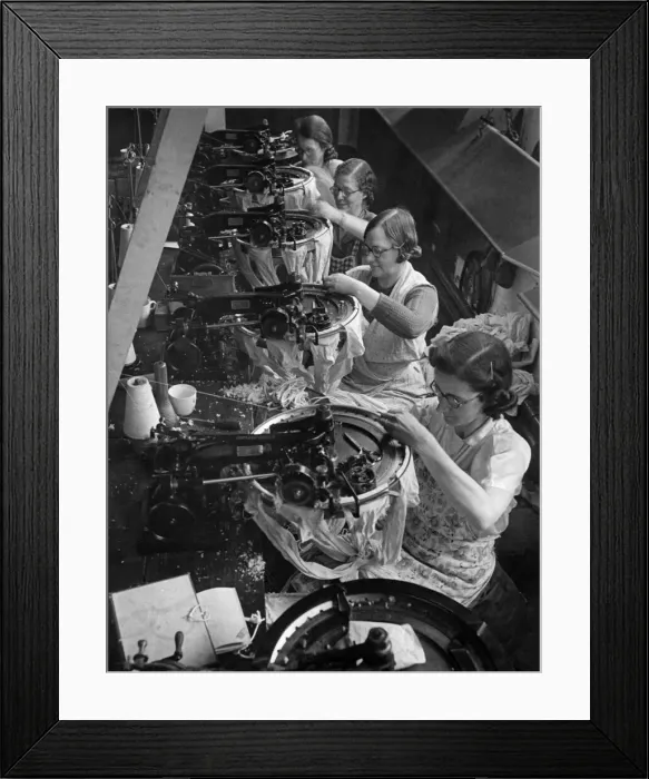 Framed Print : Clothing Stocking: Linkers fitting the stockings in line on fine points under powerful Framed Print : Clothing Stocking: Linkers fitting the stockings in line on fine points under powerful