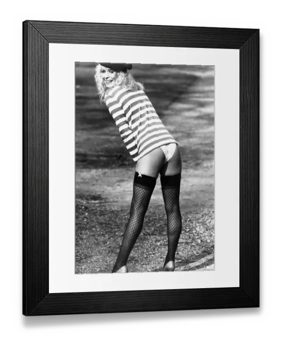 Framed Print : Clothing - Stockings: The new Folies. Top model Tessa Hewitt shows off a new style in