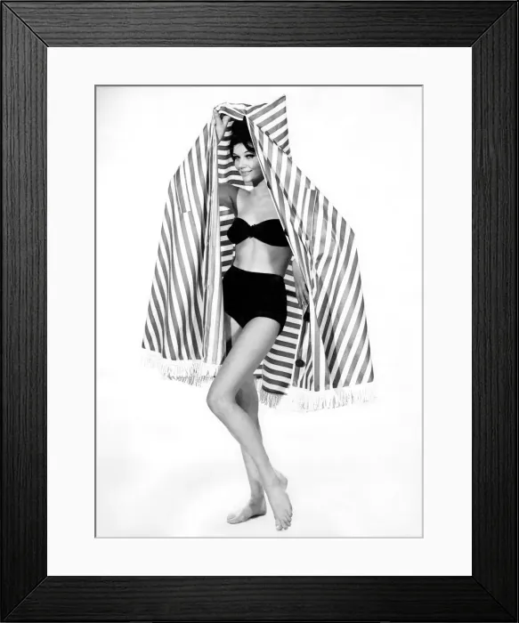 Framed Print : Clothing Beach: Merriel Weston wears a bikini and emerges from the striped cape-tent Framed Print : Clothing Beach: Merriel Weston wears a bikini and emerges from the striped cape-tent