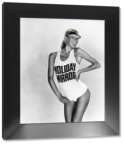 Clothing Beach. Model wears a t-shirt saying 'holiday Mirror'