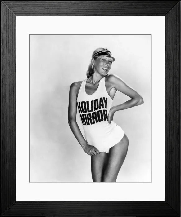 Framed Print : Clothing Beach. Model wears a t-shirt saying holiday Mirror Framed Print : Clothing Beach. Model wears a t-shirt saying holiday Mirror