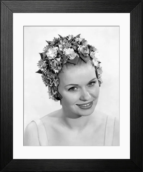 Framed Print : Clothing Beach: Garland Glory. A colourful cap with rich shades completely flower-decked