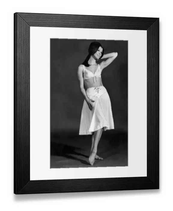 Framed Print : Clothing Underwear. Model wears a bra and knickers skirt. May 1970 P018280
