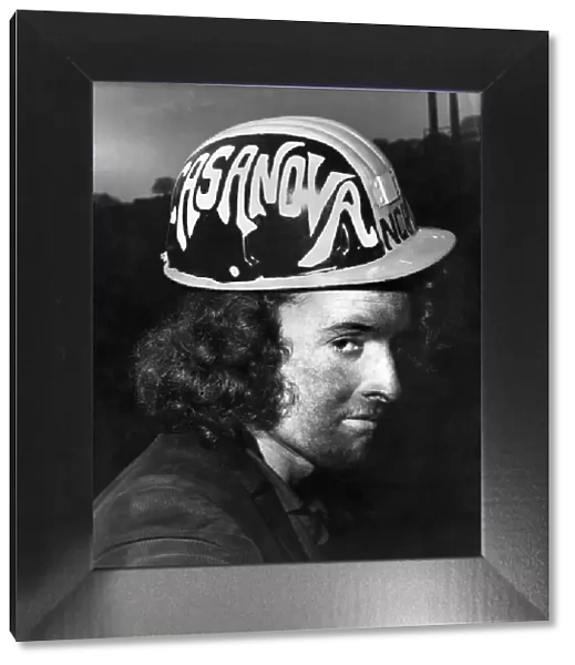 A coal miner with a specially designed helmet. December 1971 P018203