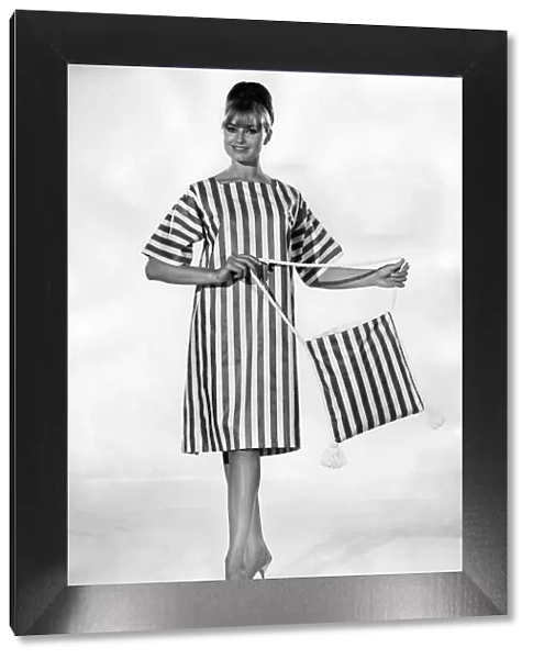 Clothing Beach. Striped beach dress and matching bag. July 1964 P017999