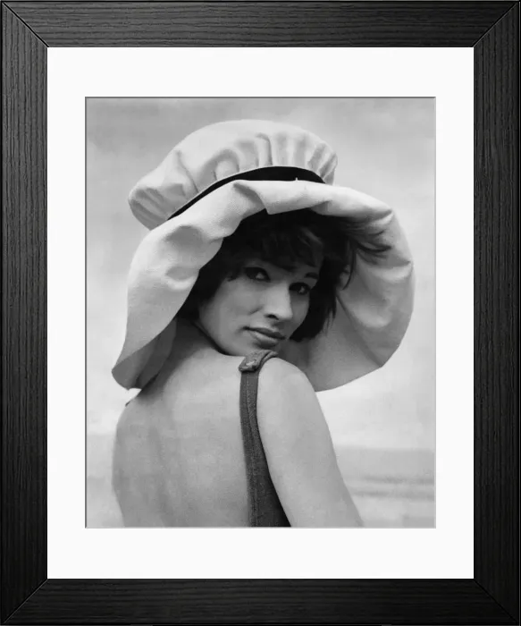 Framed Print : Clothing Beach. Look a poppet in the hat that says peek-a-boo as it keeps you cool