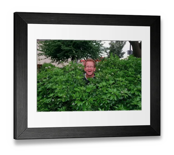 Framed Print : Eddie Edwards May 1998 Former ski jumpersitting in a bush under a tree