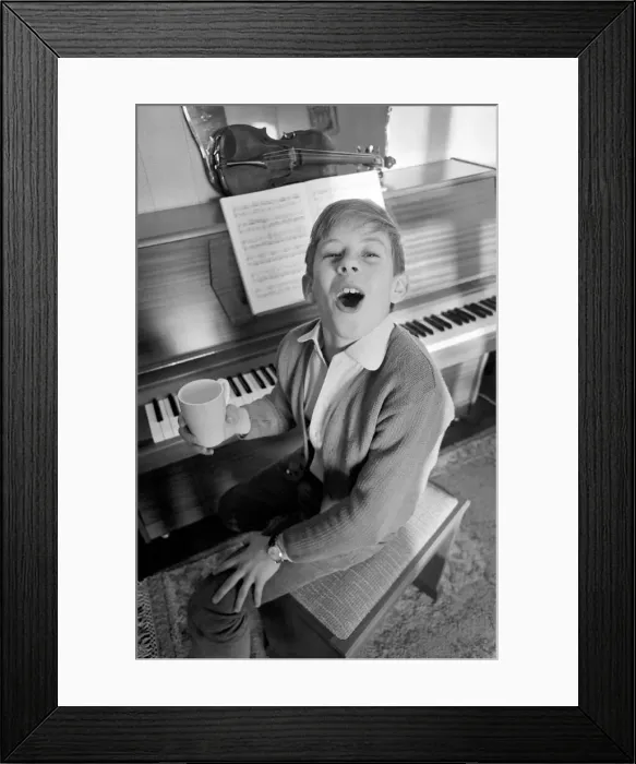 Framed Print : Children. Humour: Young boy at home setting at the piano. November 1969 Z11493-002 Framed Print : Children. Humour: Young boy at home setting at the piano. November 1969 Z11493-002