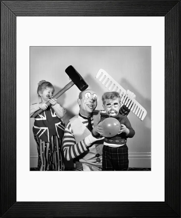 Framed Print : Four year old girl learning how to be a clown like her daddy. Blackpool clown Ernie Framed Print : Four year old girl learning how to be a clown like her daddy. Blackpool clown Ernie