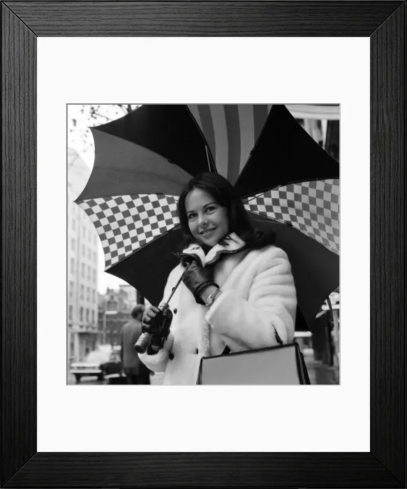 Framed Print : Wrapped up warn and dry for the cold wet London weather, Miss Canada Framed Print : Wrapped up warn and dry for the cold wet London weather, Miss Canada