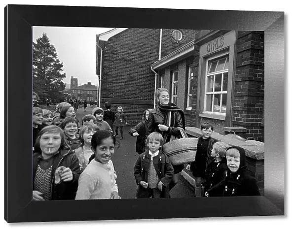 Clitheroe School Strike. Teacher Miss Kianne Kay surrounded by pupils as she returns to