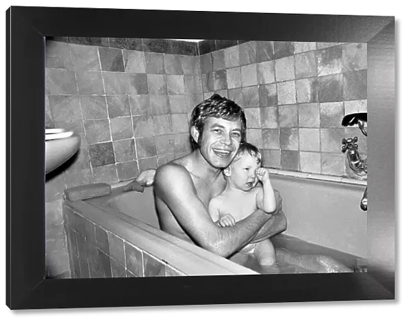 Families: Mother, father and children. Father in the bath with baby boy and son