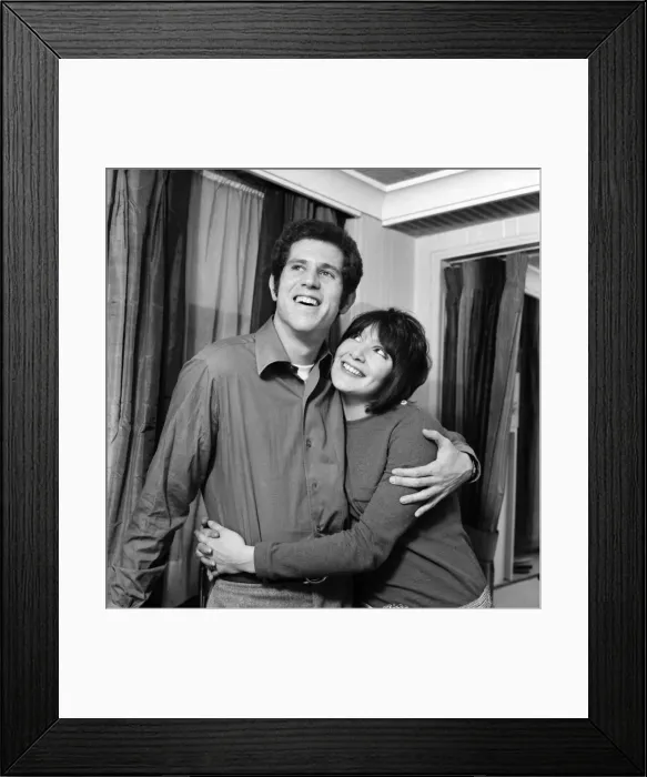 Framed Print : Couple embracing with the woman looking up to the man. December 1969 Z11624 Framed Print : Couple embracing with the woman looking up to the man. December 1969 Z11624