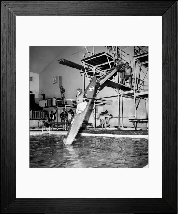 Framed Print : Young boy takes a canoe of a 10 feet high diving board at Bournemouth swimming pool Framed Print : Young boy takes a canoe of a 10 feet high diving board at Bournemouth swimming pool