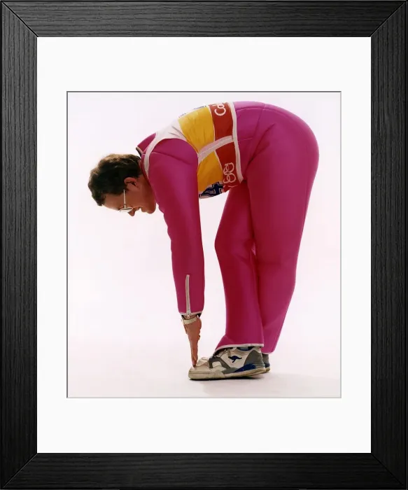Framed Print : Eddie Edwards touching his toes in pink ski clothing Framed Print : Eddie Edwards touching his toes in pink ski clothing