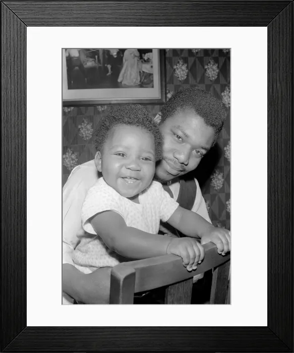Framed Print : Father with his toddler son. December 1969 Z11609-003