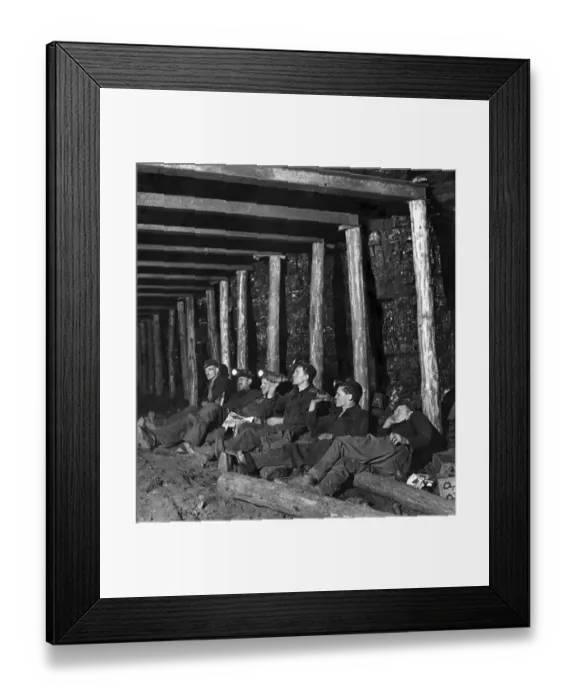 Framed Print : Mechanized coal mining. A group of miners sit down for a rest while working underground