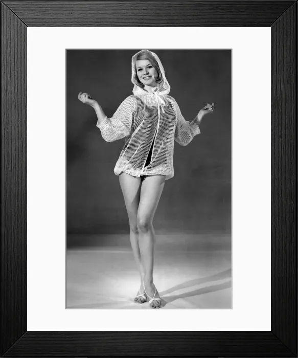 Framed Print : This cover-up with drawstring hood is in white peep-through fishnet Framed Print : This cover-up with drawstring hood is in white peep-through fishnet
