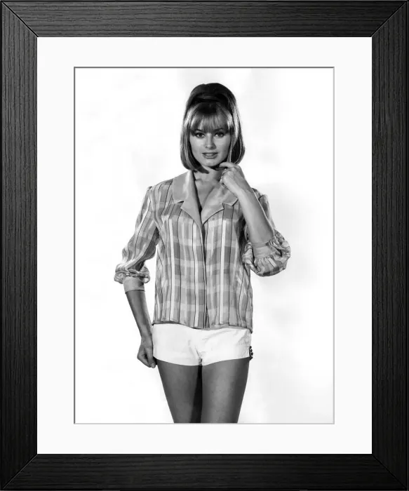 Framed Print : Clothing Beach. Woman wearing a Checked shirt jacket and white mini shorts