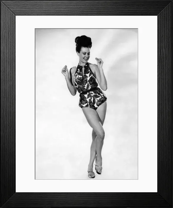 Framed Print : Woman wearing a one piece swimsuit August 1964 P018000