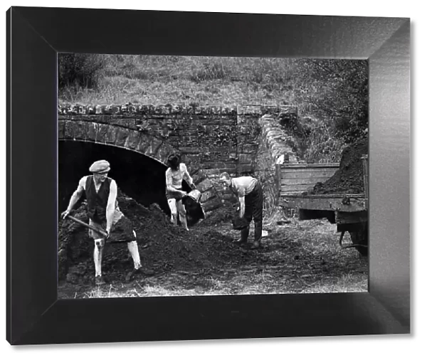 The coal is dredged in buckets from the bed of Sir Hony River at Fontllanfraith