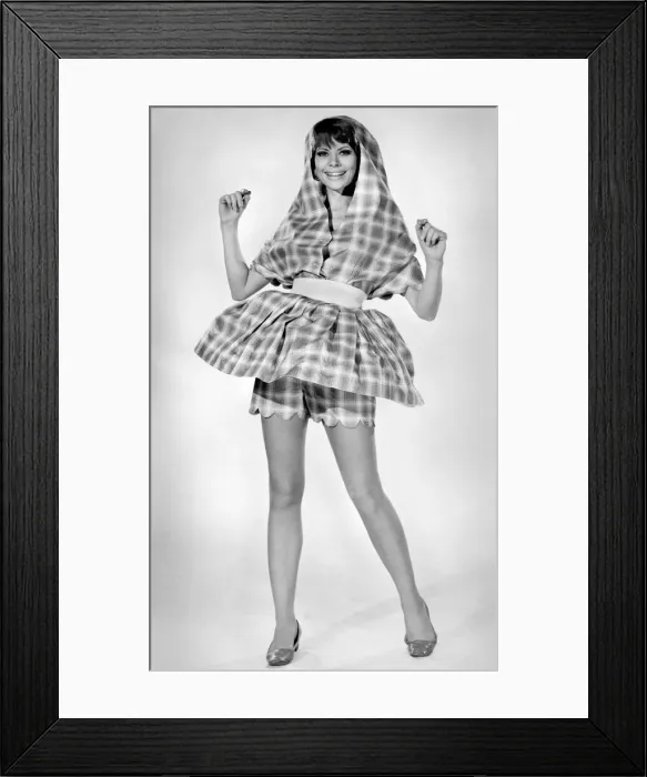 Framed Print : Woman wearing an all-in-one idea-beach hat, sunshade, shorts and a micro-mini Framed Print : Woman wearing an all-in-one idea-beach hat, sunshade, shorts and a micro-mini